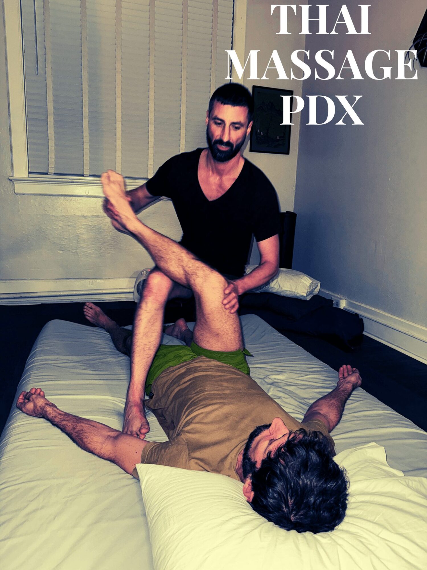 Two men in a massage room, one lying on the bed and the other sitting, with text 'THAI MASSAGE PDX' in the top right corner.