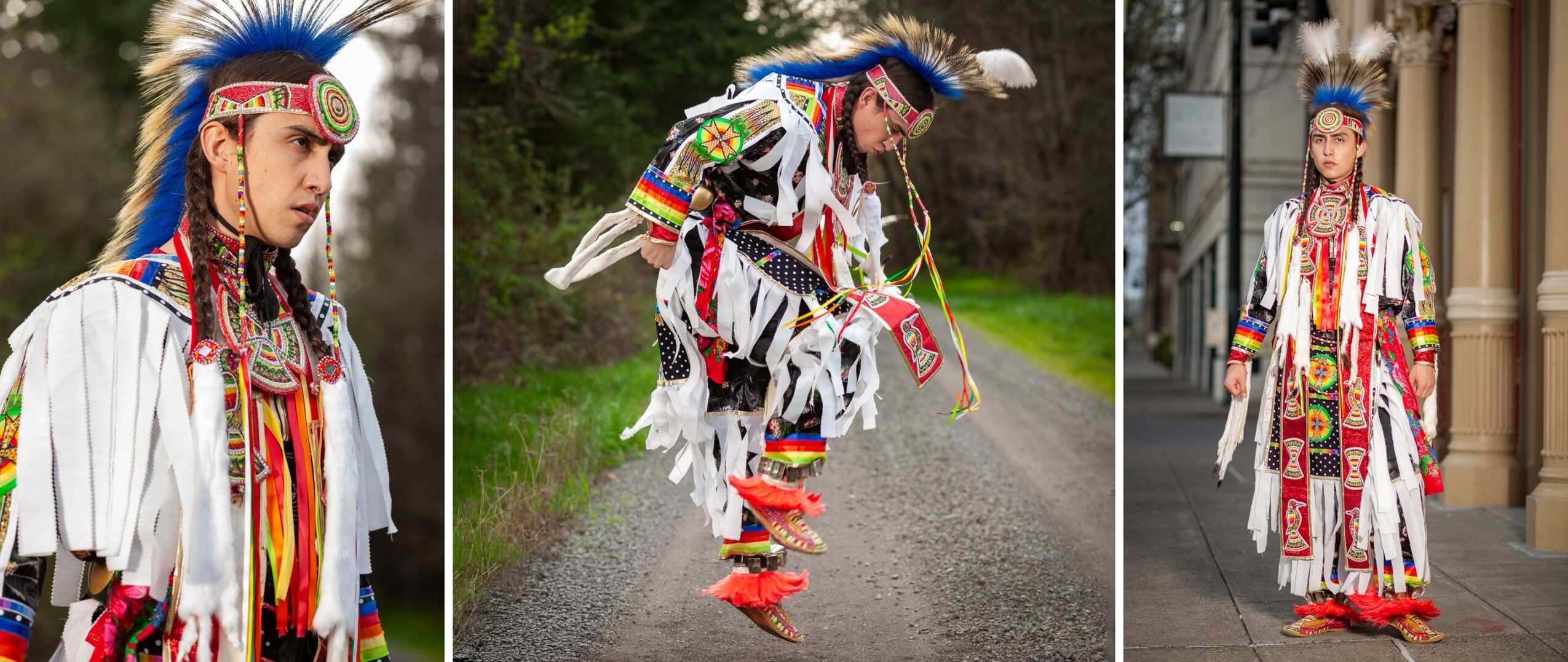 Person in traditional Native American attire with feathered headdress and colorful clothing, standing outdoors and walking on a paved path.