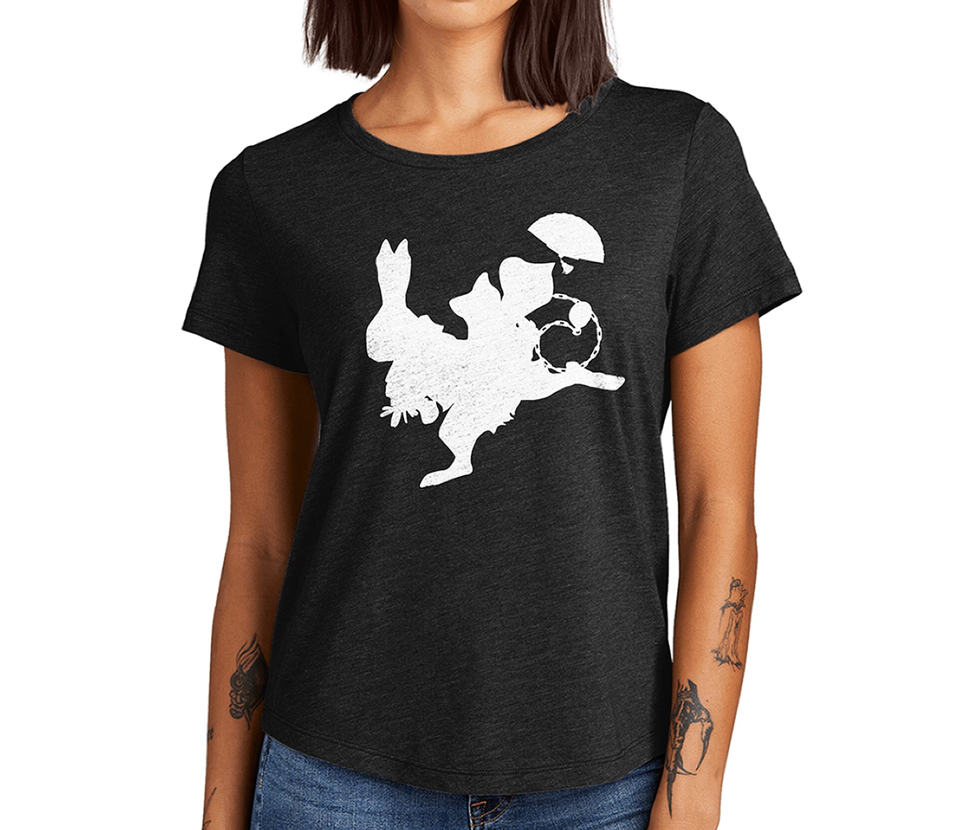 Black T-shirt with a white graphic of a person riding a winged creature holding an umbrella, person has a hat, woman with tattoos on arms