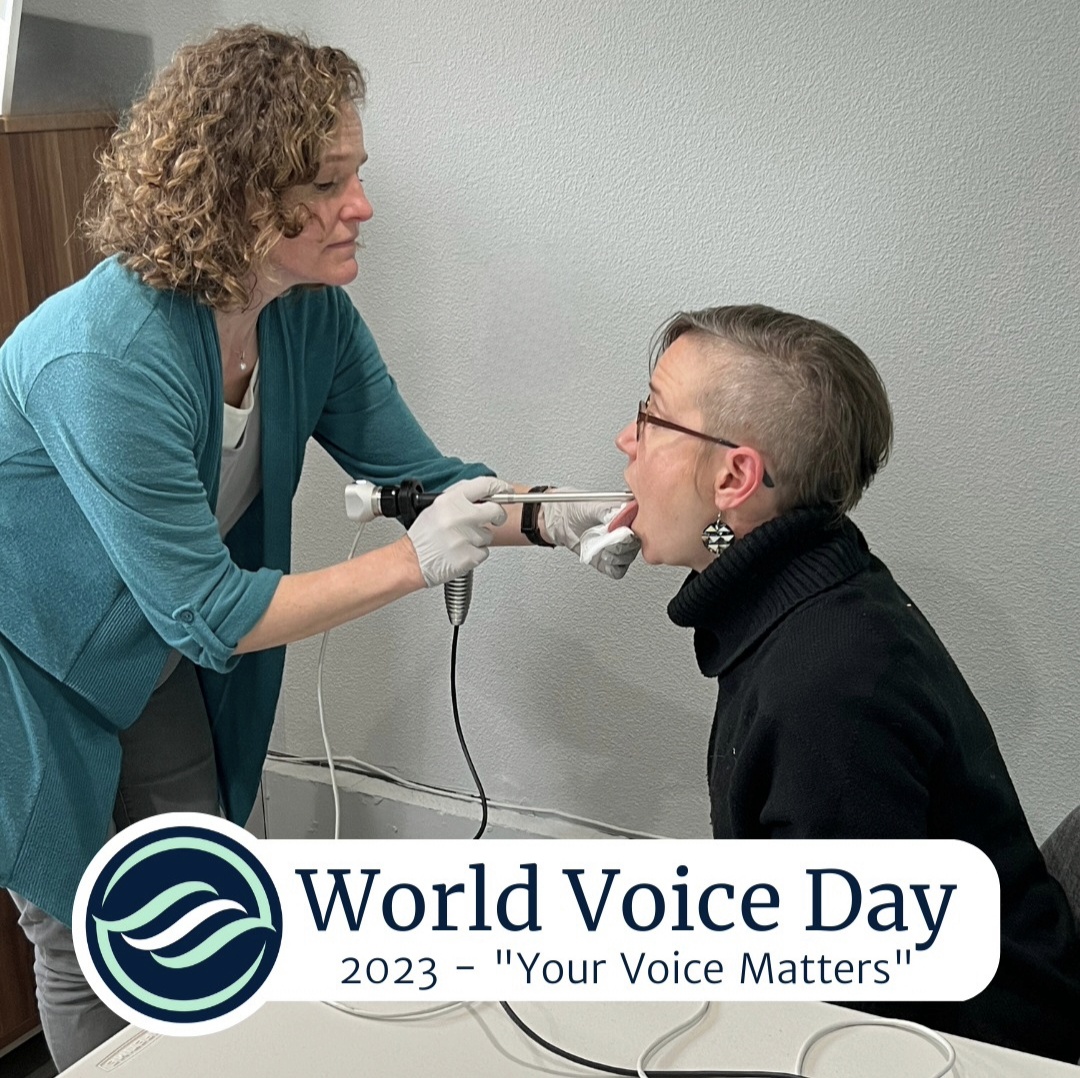 A healthcare professional performs a throat examination on a young man in a clinical setting, promoting World Voice Day 2023.